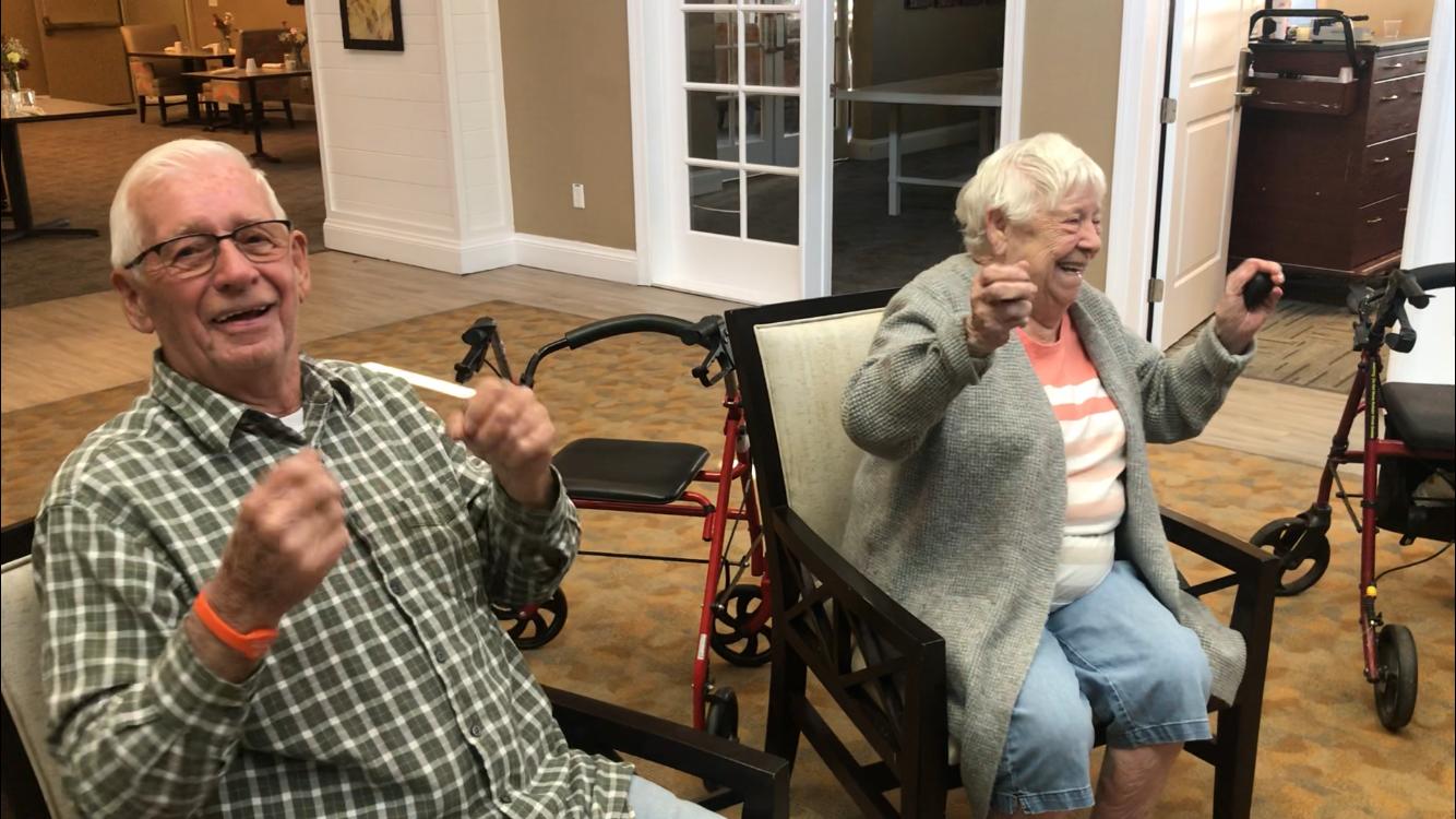 Residents laughing together as an ensemble