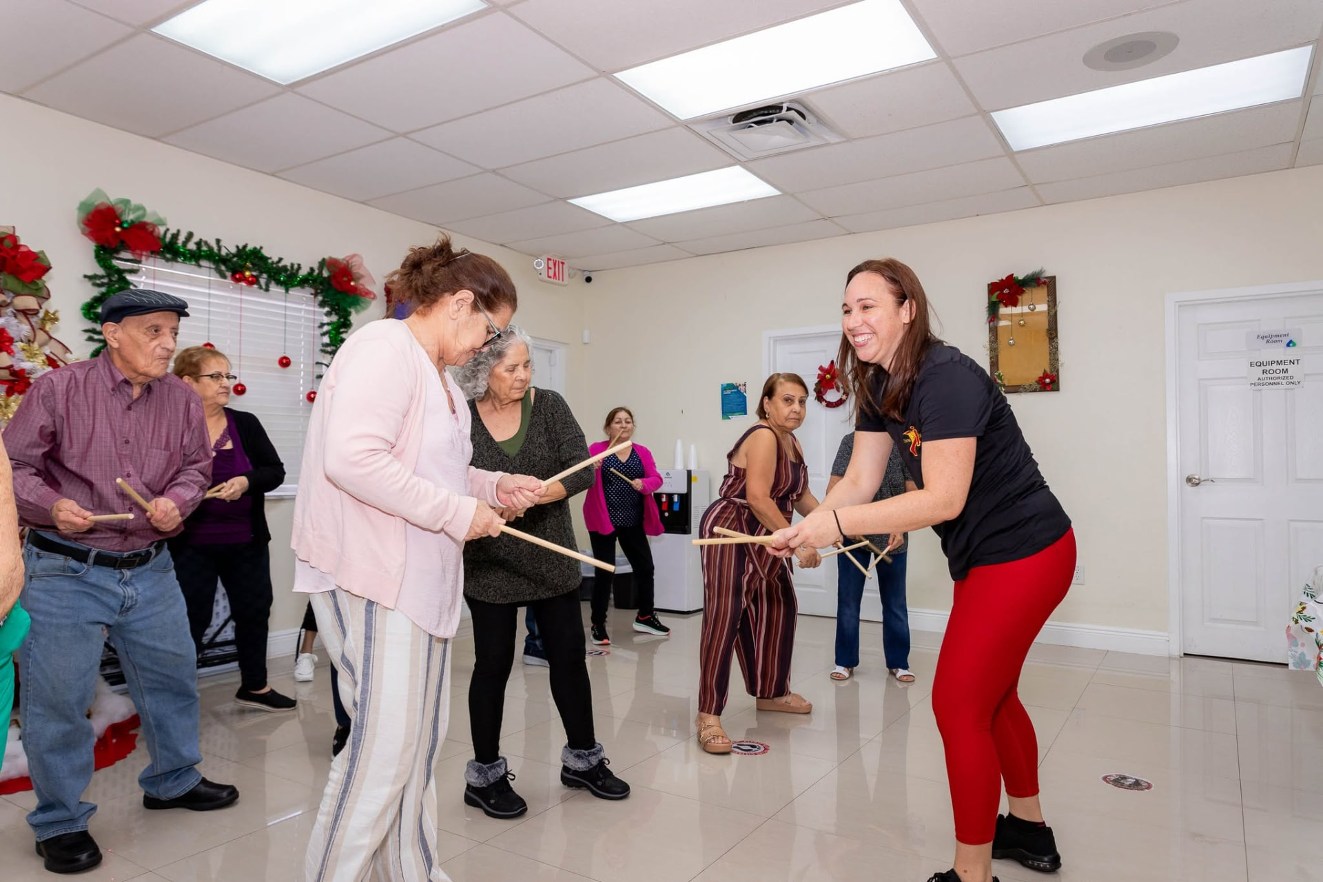 InstruMix instructor leading older adults in a rhythm sticks class
